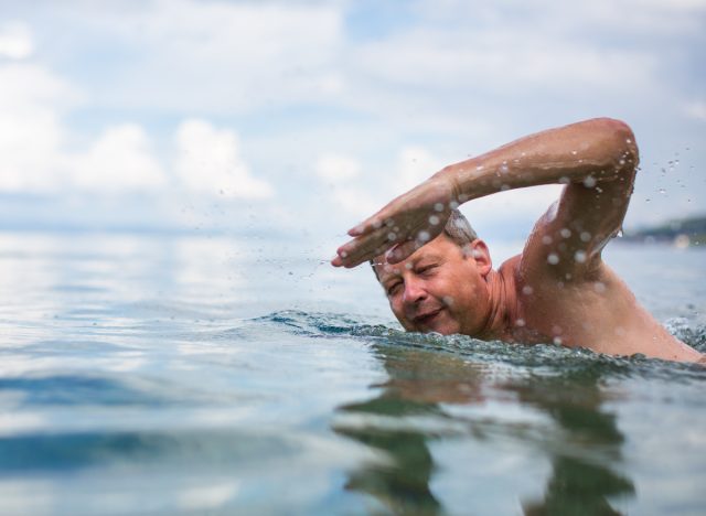 mature man swims laps, shows cardio exercises to improve your endurance as you age