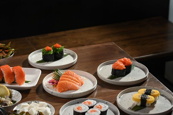 A variety of traditional Japanese dishes on a rustic wooden background