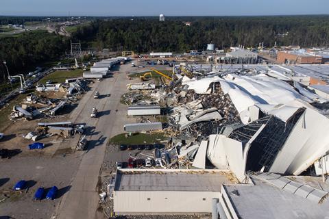 A modern industrial plant that has been torn up by high winds