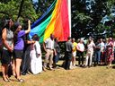 Flag raising ceremony at Vancouver City Hall for Pride Week.