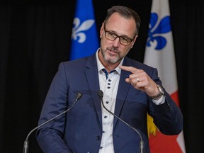 Quebec's French Language Minister Jean-François Roberge speaks at a press conference at Montreal City Hall.